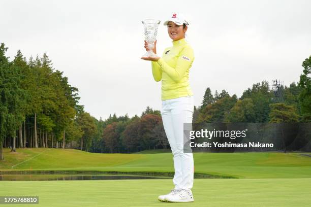 Mone Inami of Japan poses with the trophy after winning the tournament following the final round of the TOTO Japan Classic at the Taiheiyo Club's...