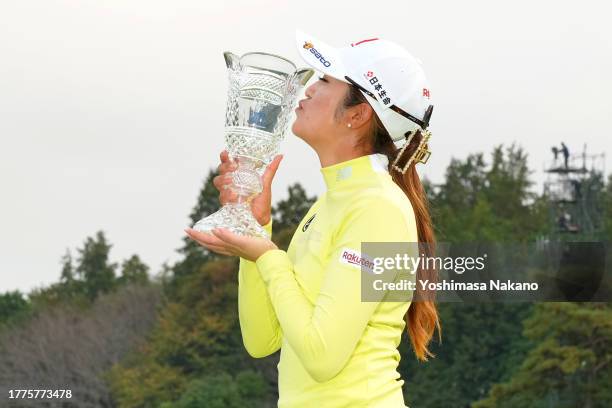 Mone Inami of Japan kisses the trophy after winning the tournament following the final round of the TOTO Japan Classic at the Taiheiyo Club's Minori...