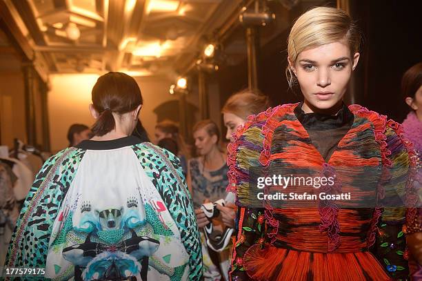 Model Luisa Hartema prepares backstage ahead of the MBFWA Trends show during Mercedes-Benz Fashion Festival Sydney 2013 at Sydney Town Hall on August...