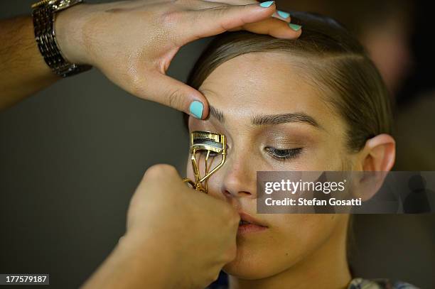 Model prepares backstage ahead of the MBFWA Trends show during Mercedes-Benz Fashion Festival Sydney 2013 at Sydney Town Hall on August 24, 2013 in...