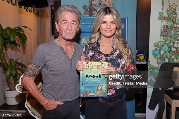 Peter Maffay and Hendrikje Balsmeyer during a signing session at Bergedorf shopping mall on November 11, 2023 in Hamburg, Germany.