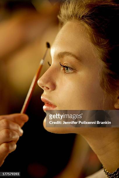 Model prepares backstage ahead of the Kardashian Kollection show during Mercedes-Benz Fashion Festival Sydney 2013 at Sydney Town Hall on August 24,...