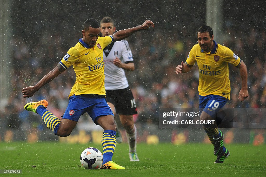 Arsenal's English midfielder Theo Walcott shoots during the English