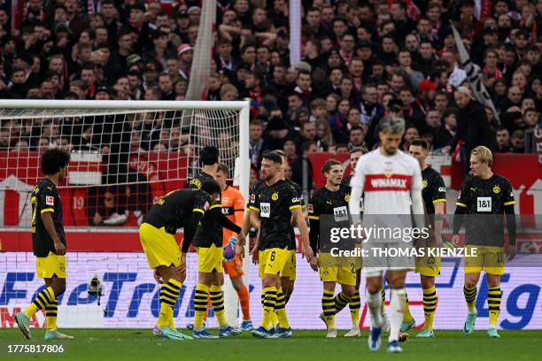 Dortmund's German forward Niclas Fuellkrug celebrates scoring the opening goal with his teammates during the German first division Bundesliga...