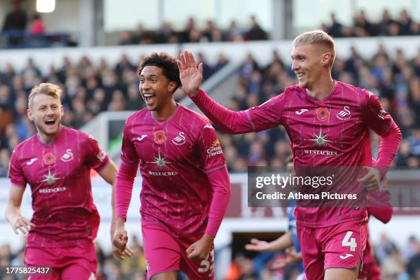 Jay Fulton of Swansea City celebrates his goal with team mates Harry Darling and Bashir Humphreys during the Sky Bet Championship match between...