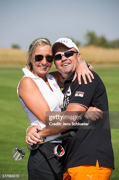 Former Boxing champ Sven Ottke and his partner Monic Frank take part in the 6th GRK Golf Charity Masters at Golf & Country Club Leipzig on August 24,...