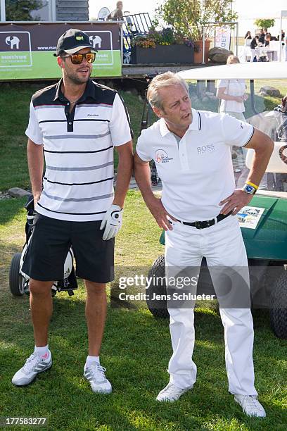Michael Ballack and Steffen Goepel, chairman of the GRK Holding, take part in the 6th GRK Golf Charity Masters at Golf & Country Club Leipzig on...