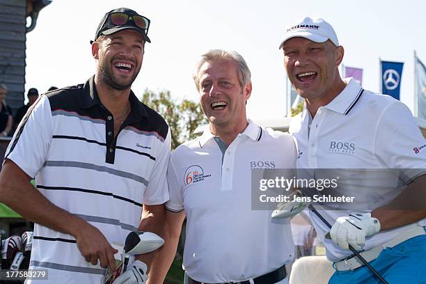 Michael Ballack , Steffen Goepel, chairman of the GRK Holding, and Axel Schulz take part in the 6th GRK Golf Charity Masters at Golf & Country Club...
