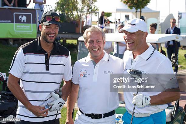 Michael Ballack , Steffen Goepel, chairman of the GRK Holding, and Axel Schulz take part in the 6th GRK Golf Charity Masters at Golf & Country Club...