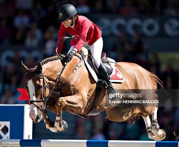 Switzerland's Janika Sprunger on her horse Palloubet d'Halong competes in the FEI European Jumping Championship Individual Finals in Herning,...