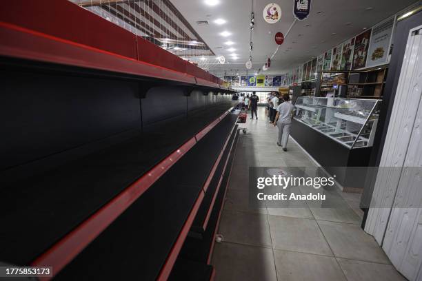View of empty shelves at a supermarket amidst Israel's bombardments as Palestinians have trouble finding necessary food in Khan Yunis, Gaza on...
