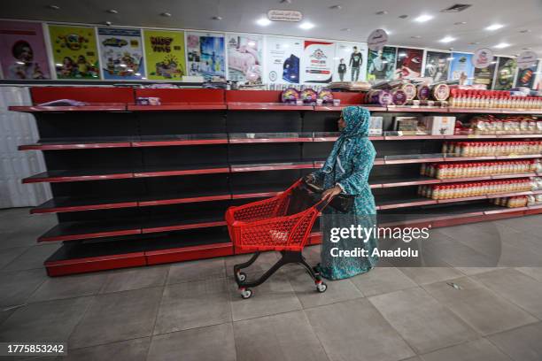 View of empty shelves at a supermarket amidst Israel's bombardments as Palestinians have trouble finding necessary food in Khan Yunis, Gaza on...
