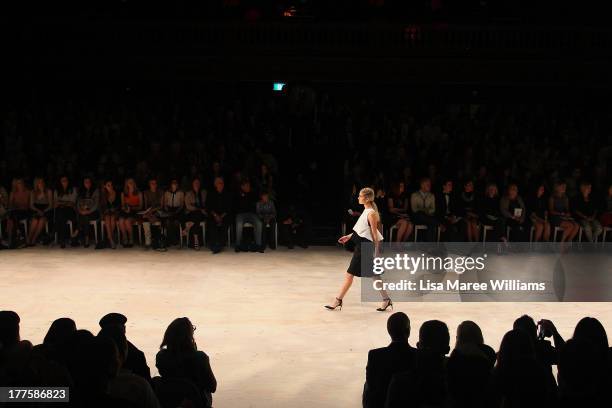 Model showcases designs on the runway at the MBFWA Trends show during Mercedes-Benz Fashion Festival Sydney 2013 at Sydney Town Hall on August 24,...