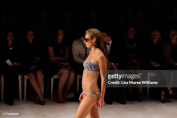 Model showcases designs by White Sands on the runway at the MBFWA Trends show during Mercedes-Benz Fashion Festival Sydney 2013 at Sydney Town Hall...