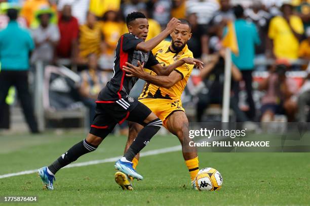 Orlando Pirates' #38 Relebohile Mofokeng fights for the ball with Kaizer Chiefs' #39 Reeve Frosler during the Premier Soccer League South African...