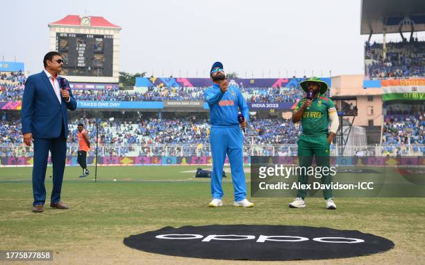 Rohit Sharma of India flips the coin as Temba Bavuma of South Africa looks on ahead of the ICC Men's Cricket World Cup India 2023 between India and...