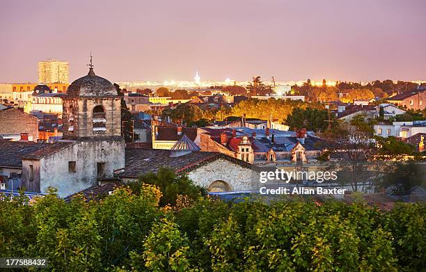 cityscape of montpellier at night - hérault stock-fotos und bilder