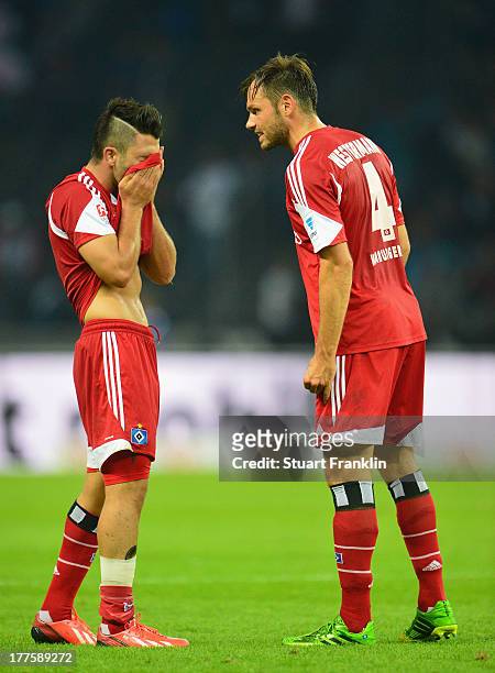 Tolgay Arslan and Heiko Westermann of Hamburg look dejected at the end of the Bundesliga match between Hertha BSC and Hamburger SV at Olympiastadion...