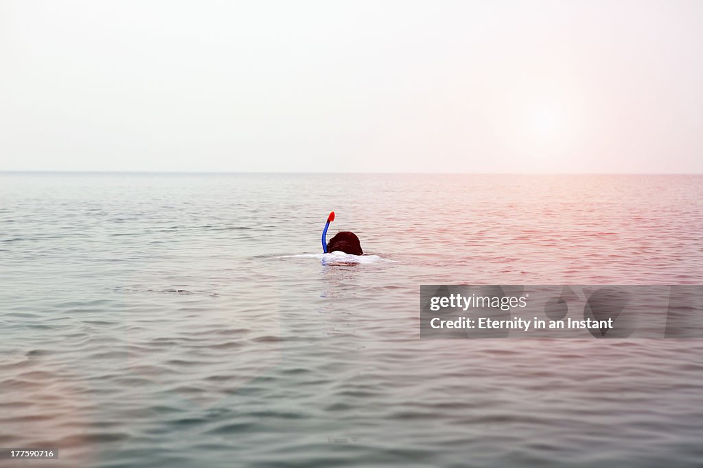 Boy snorkelling in ocean