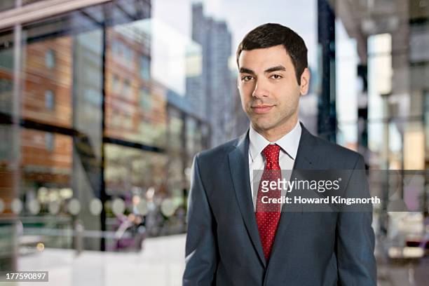 businessman looking to camera - red tie stock pictures, royalty-free photos & images