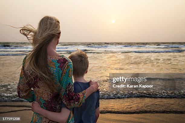 mother and son looking at sunset - blonde hair back stock pictures, royalty-free photos & images