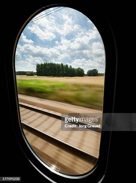 view out of a high speed train - hogesnelheidstrein stockfoto's en -beelden