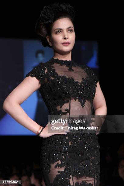 Ankita Shorey showcases designs by Rocky S on the runway during day 2 of Lakme Fashion Week Winter/Festive 2013 at the Hotel Grand Hyatt on August...