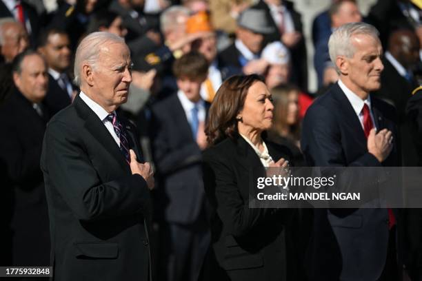President Joe Biden, with Vice President Kamala Harris and Veterans Affairs Secretary Denis McDonough, attends a wreath-laying ceremony at the Tomb...