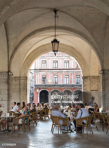 Customers sits at a cafe in the city centre on August 24, 2013 in Treviso, Italy. Treviso claims that Tiramisu was invented in the 1960s by Alba...