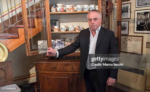 Carlo Campeol the present owner of Restaurant "Alle Beccherie" and son of Alba shows a picture of the restaurant during the second world war on...