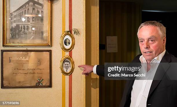 Carlo Campeol the present owner of Restaurant "Alle Beccherie" and son of Alba indicate the photographs of his grandparents who started the...