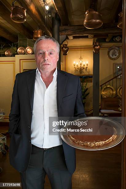 Carlo Campeol the present owner of Restaurant "Alle Beccherie" and son of Alba poses in front of the Restaurant with a freshly made Tiramisu on...