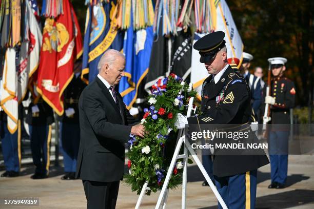 President Joe Biden lays a wreath at the Tomb of the Unknown Soldier in Arlington National Cemetery during celebrations for Veterans Day, on November...