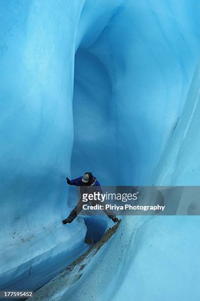 adventure in an ice tunnel - root glacier stock-fotos und bilder