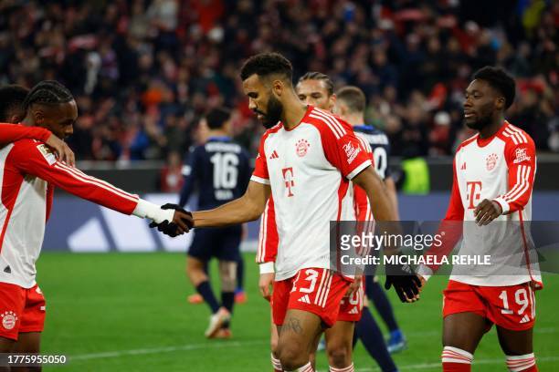 Bayern Munich's Cameroonian forward Eric Maxim Choupo-Moting celebrates scoring the 4-2 goal with Bayern Munich's Canadian midfielder Alphonso Davies...