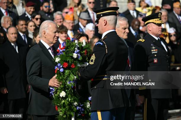 President Joe Biden lays a wreath at the Tomb of the Unknown Soldier in Arlington National Cemetery during celebrations for Veterans Day, on November...