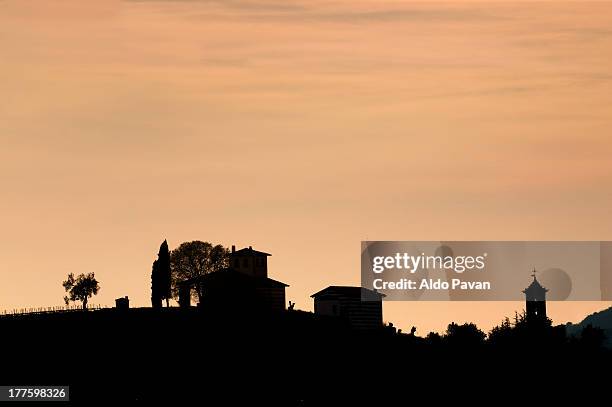 italy, borgonato, silhouette at sunset - town silhouette stock pictures, royalty-free photos & images