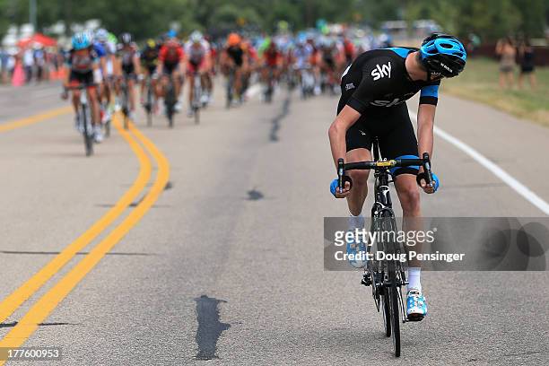Chris Froome of Great Britain riding for Sky Pro Cycling looks back at the peloton as he launches an attack early in stage six of the 2013 USA Pro...