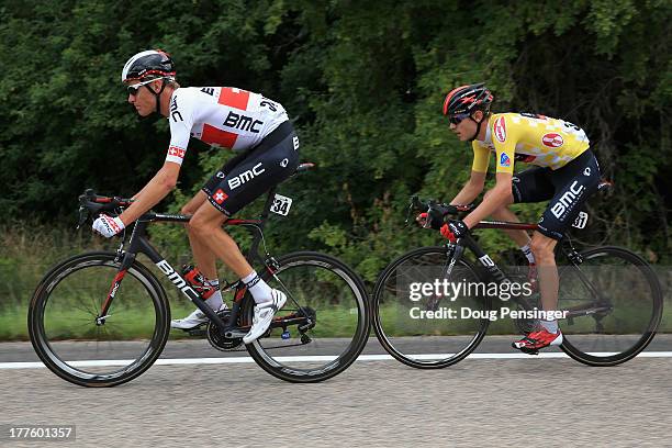 Michael Schar of Switzerland riding for BMC Racing leads the way for team leader Tejay van Garderen of the USA riding for BMC Racing as he defended...