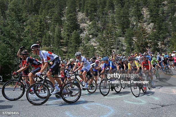 Tejay van Garderen of the USA riding for BMC Racing in the overall race leader's yellow jersey makes the climb of Devil's Gulch with the peloton...