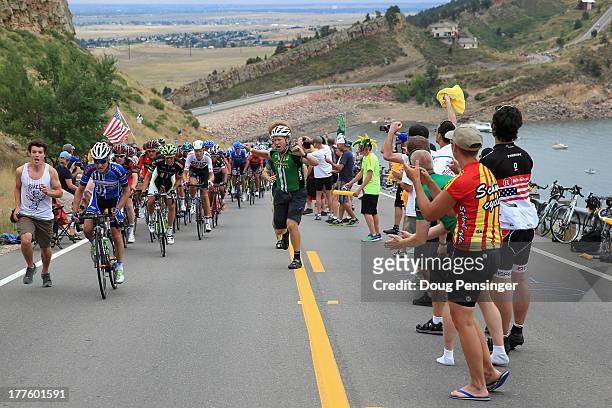 Fans line a climb as the peloton makes its way along Horsetooth Reservoir during stage six of the 2013 USA Pro Challenge from Loveland to Fort...