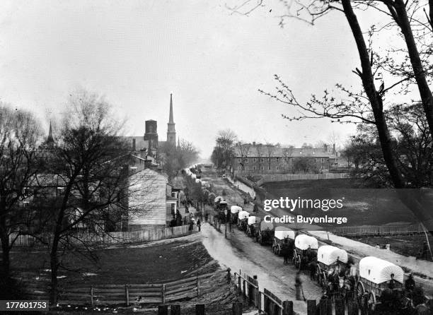 First Union wagon train entering the city of Petersburg, with provisions after the Rebels were forced to evacuate, Petersburg, Virginia, 1865. The...