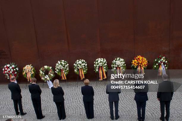 German Chancellor Angela Merkel , Berlin's Major Klaus Wowereit , Germany's President Christian Wulff and Axel Klausmeier , Director of the Berlin...