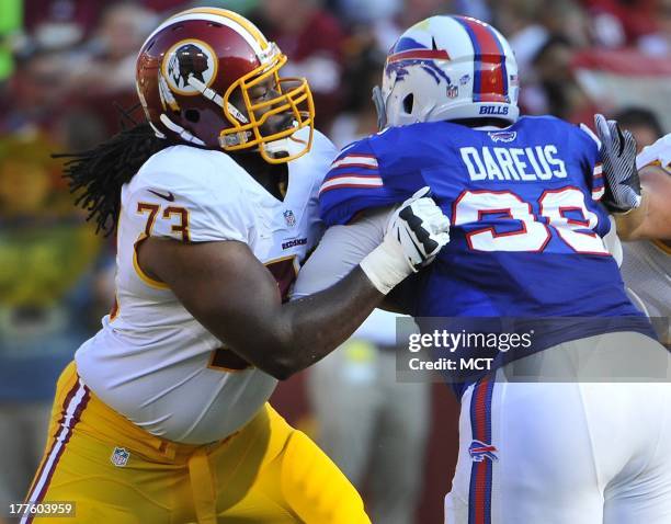 Washington Redskins guard Adam Gettis and Buffalo Bills defensive tackle Marcell Dareus face-off during an NFL preseason game at FedEx in Landover,...