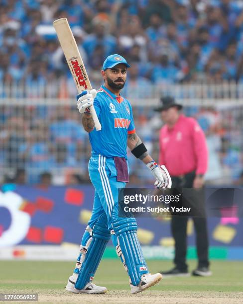 Virat Kohli of India celebrates their half century during the ICC Men's Cricket World Cup India 2023 between India and South Africa at Eden Gardens...