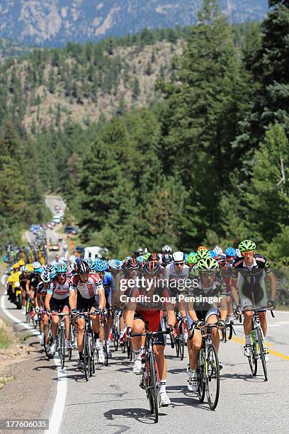 Racing and Cannondale Pro Cycling lead the peloton on the climb of Devil's Gulch during stage six of the 2013 USA Pro Challenge from Loveland to Fort...