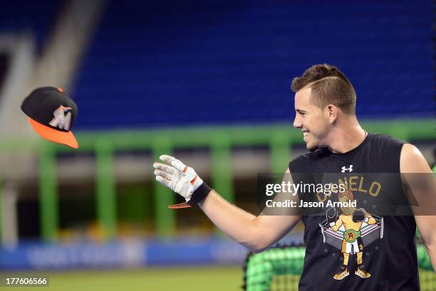 Miami Marlins pitcher Jose Fernandez throws his hat off during batting practice prior to a game against the Colorado Rockies at Marlins Park on...