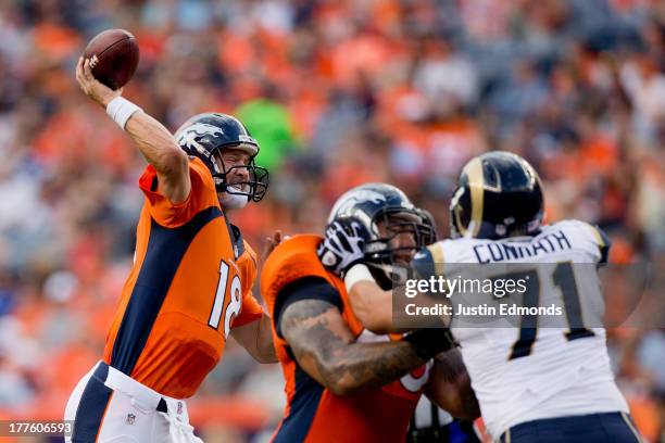 Quarterback Peyton Manning of the Denver Broncos throws a pass against the St. Louis Rams during the first quarter at Sports Authority Field Field at...