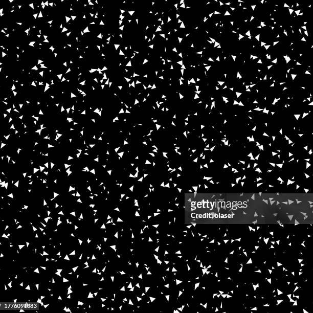 a stark black background scattered with an array of white triangles creating a random, starry night effect. - scatter stock illustrations