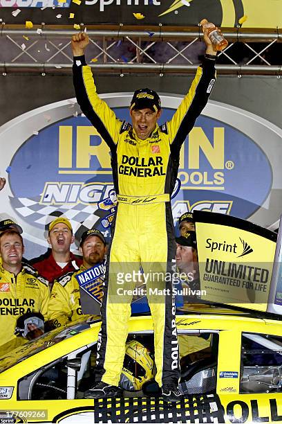 Matt Kenseth, driver of the Dollar General Toyota, celebrates in Victory Lane after winning the NASCAR Sprint Cup Series 53rd Annual IRWIN Tools...
